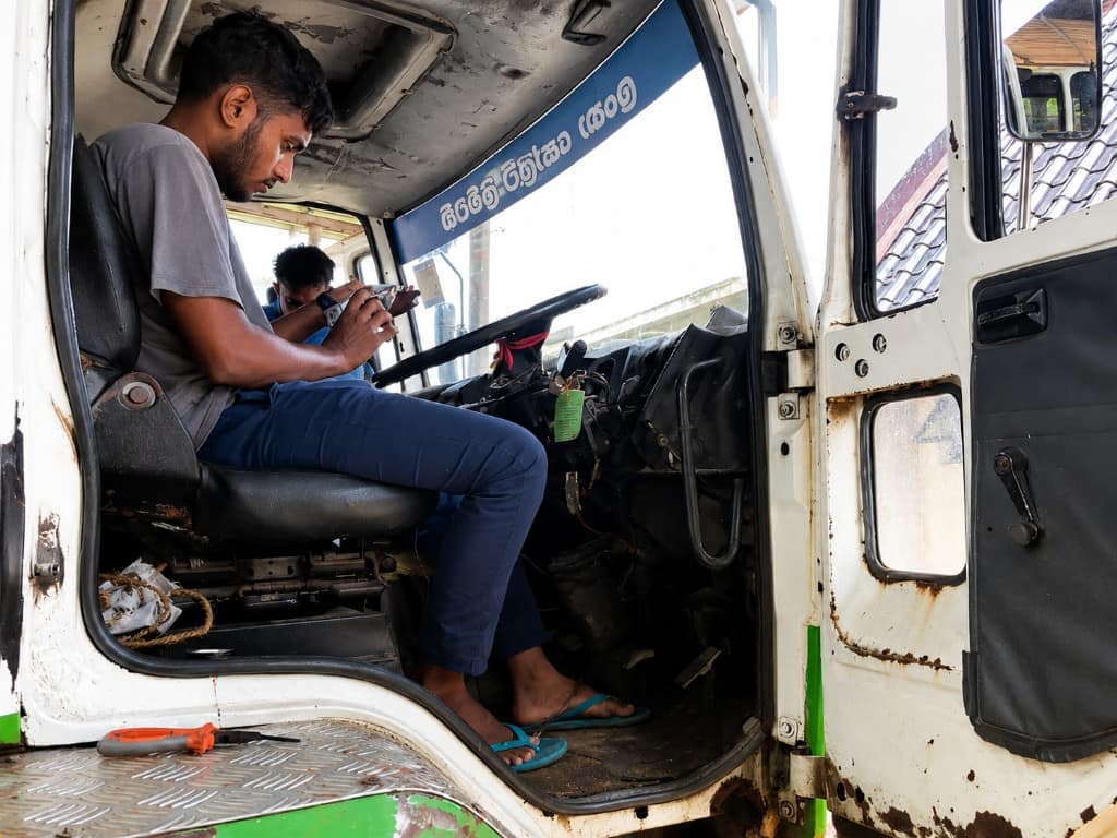 CityTrack technician installing a GPS tracker in a vehicle cab